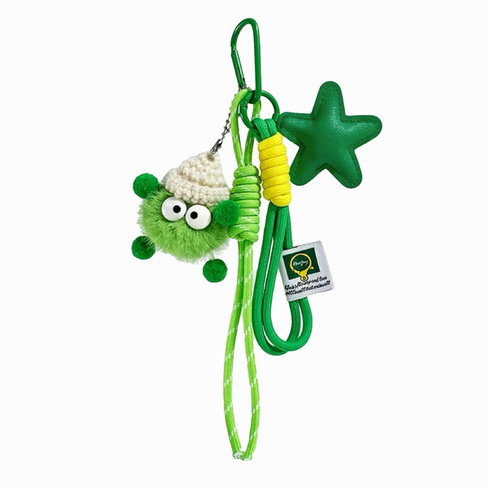Vibrant green coalball bag charm with a matching green star and ropes; playful maximalist accessory for street style.