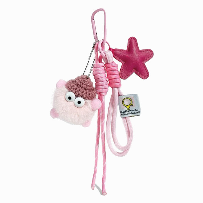 Soft pink coalball bag charm with a pink star and knotted ropes; cute aesthetic gift for handbag lovers.