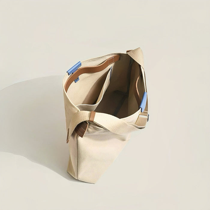 Interior view of sturdy canvas tote bag with functional slip pockets ideal for organizing small essentials.