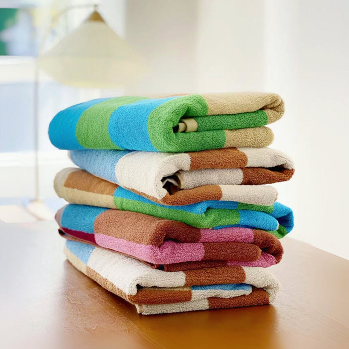 Five Color Game Plaid Face Towel in various colors are stacked together.