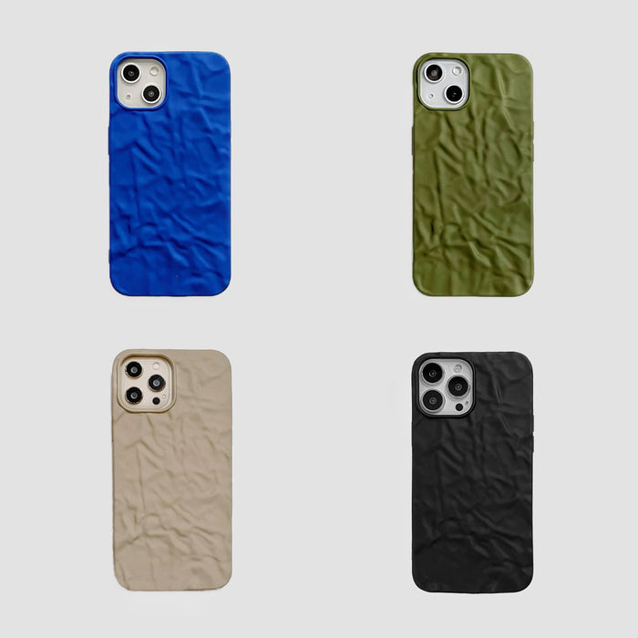 Collection of four pleated silicone iPhone cases in blue, olive green, beige, and black. Trendy 3D texture.