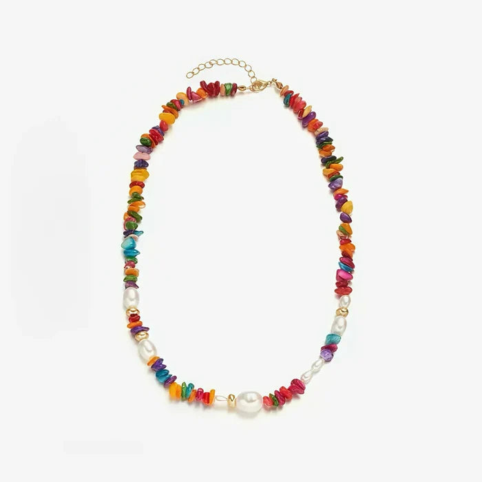 Front view of multiple color-pop beaded necklaces stacked to show the vibrant textures .