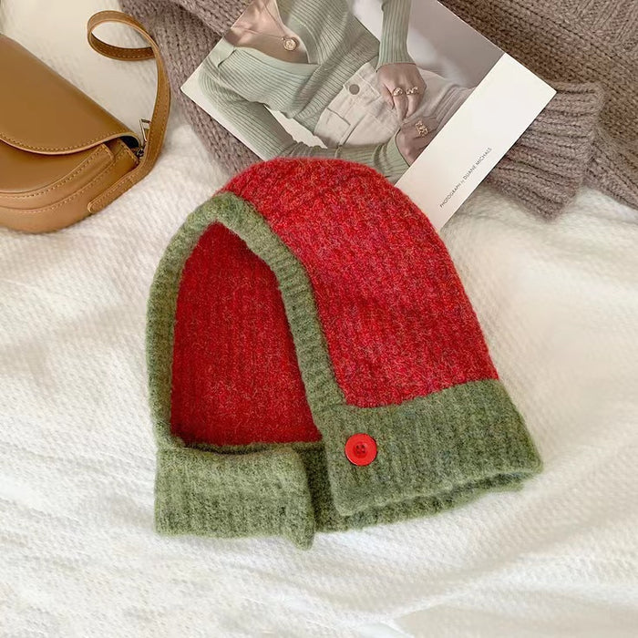 Front view of green balaclava hat with bold color-blocked panels, crafted for durability and warmth.