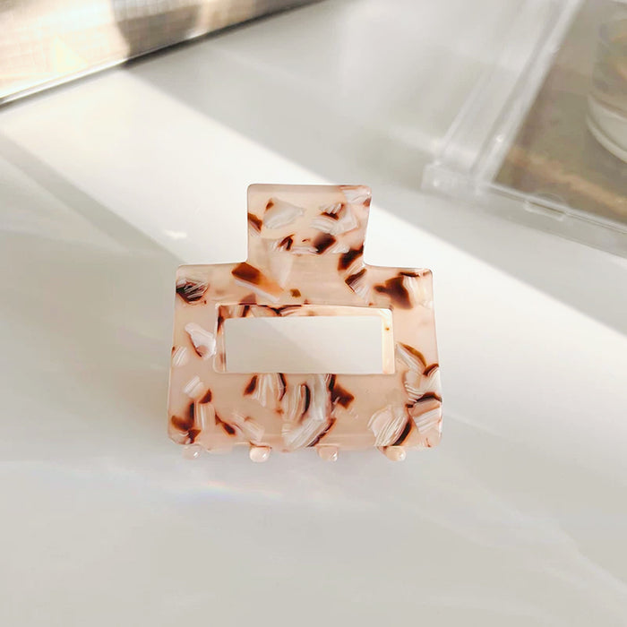 Angled view of Color Square Hair Claw in coffee , ideal for quick updos and ponytails.