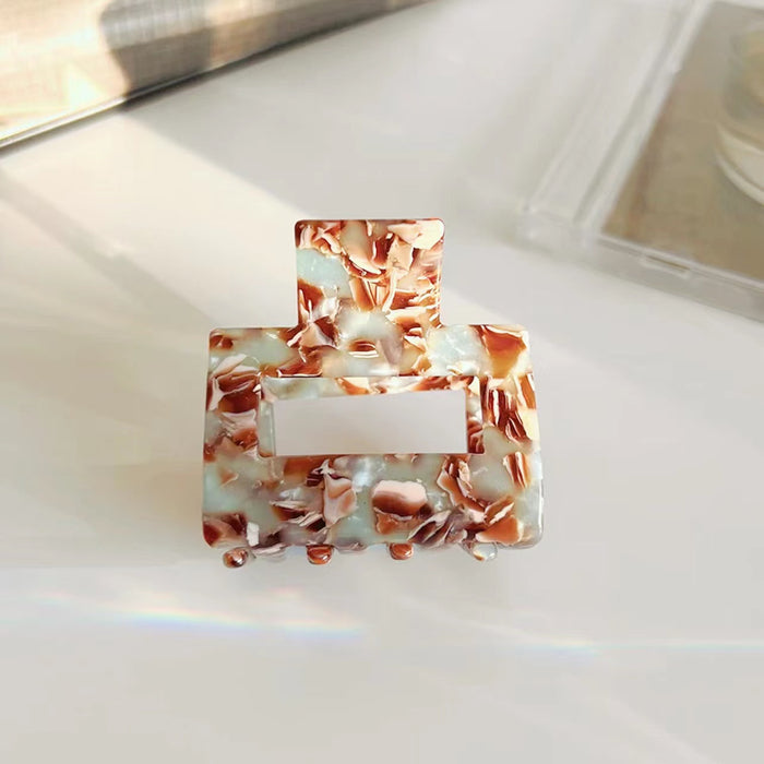 Flat lay of Color Square Hair Claw in cyan , great for everyday styling and gifting.