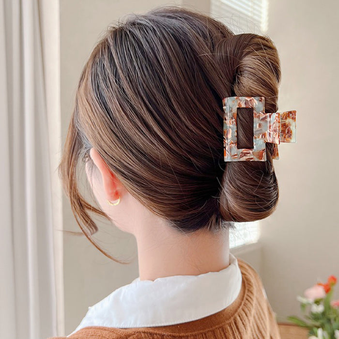 Model wearing Color Square Hair Claw in cyan, ideal for quick updos and ponytails.