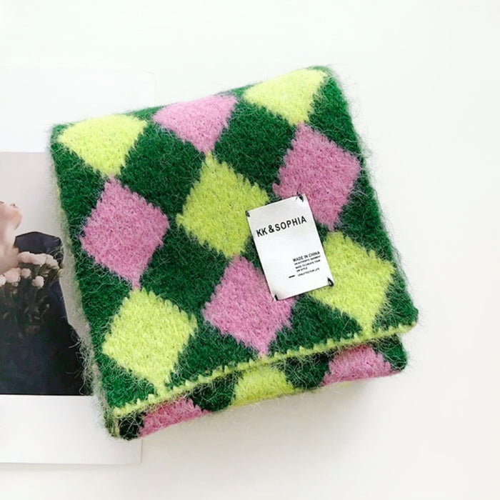 Angled view of Wool-acrylic colorblock diamond scarf in vibrant pink, lime green, and dark green, easy for travel.