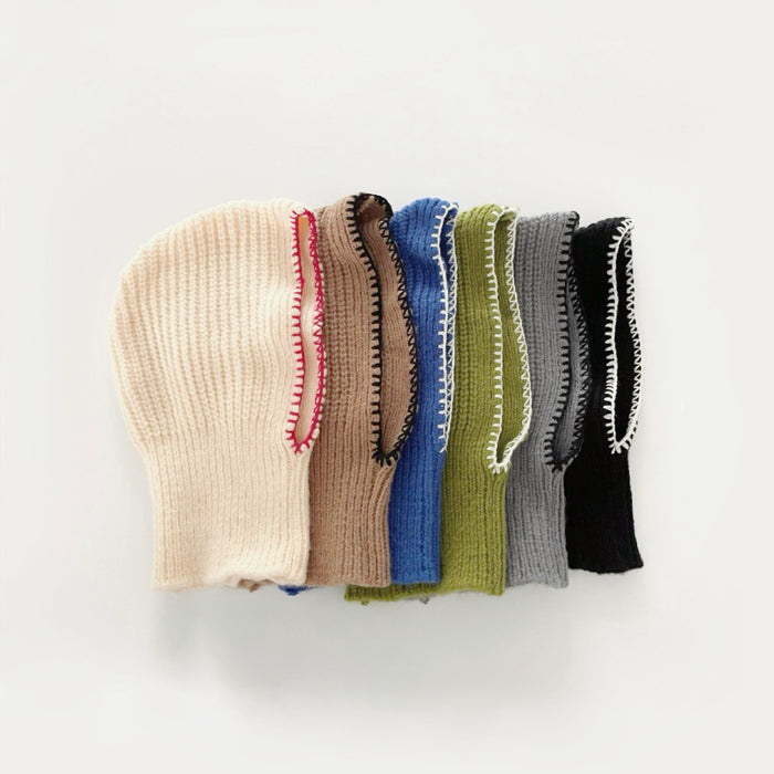 Six colors of knitted acrylic-cotton balaclava hats, each featuring contrasting colored edges.