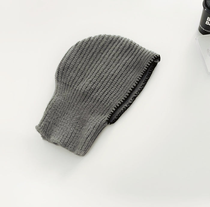 Front view of grey balaclava hat with contrast edges, featuring a soft and breathable knitted texture.