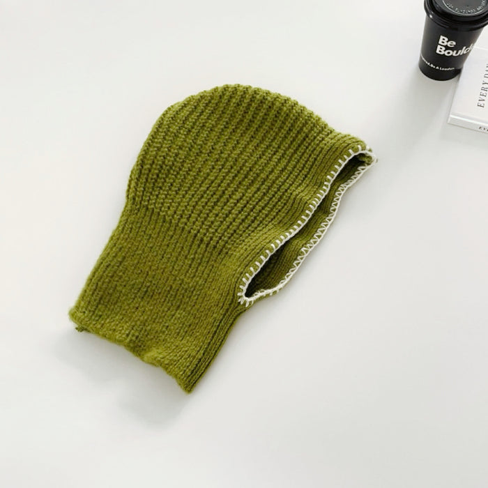 Front view of green balaclava hat with contrast edges, providing a modern and cozy headwear option.