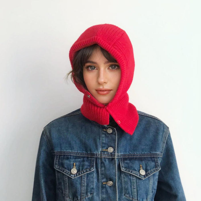 Model wearing vibrant multi-tone pattern balaclava hat, showcasing a unique and artistic knitted design.