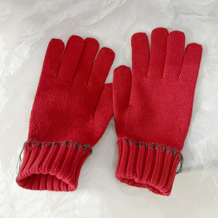 Red colored-thread hemming gloves with contrast stitched edges; cozy knit gloves for winter days.