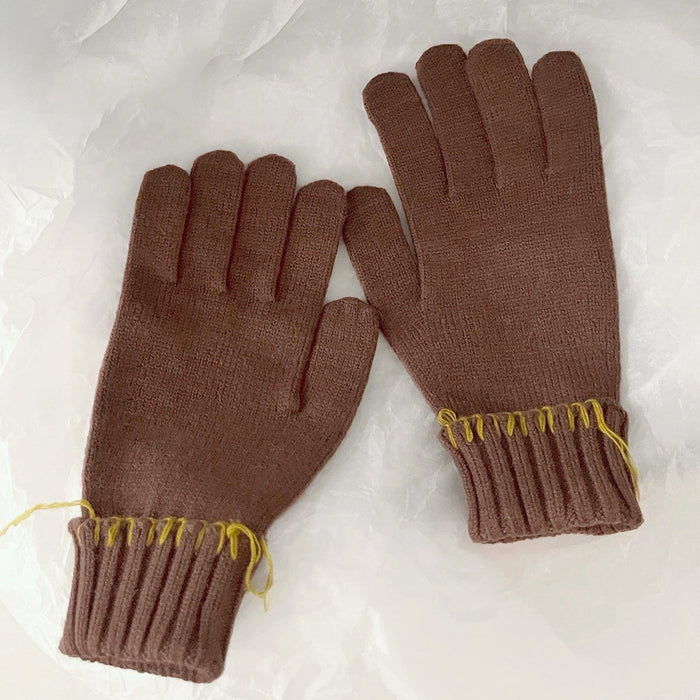 Brown colored-thread hemming gloves with contrast stitched seams; warm knit accessory for outdoors.