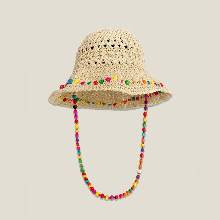 Front view of the beige woven straw hat with a colorful beaded band and hanging cord.