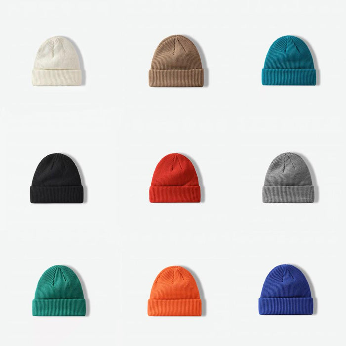 Nine vibrant knitted beanies in multi-color yarns, featuring a soft and breathable cotton-acrylic blend.
