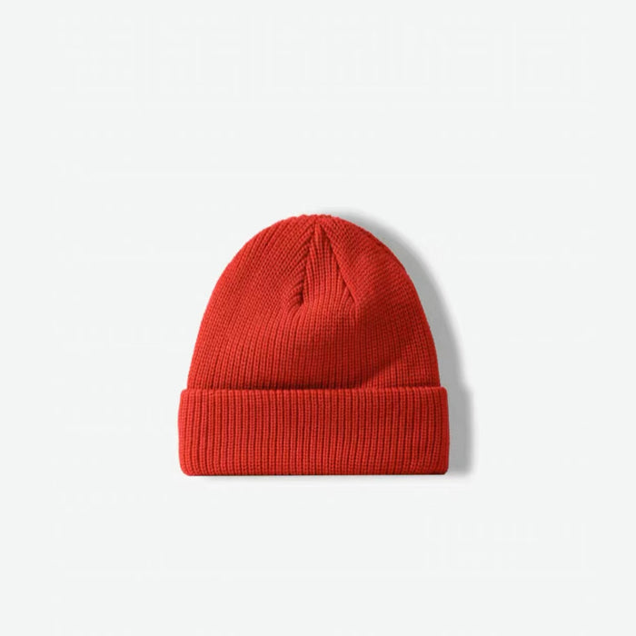 Front view of red multi-color beanie. Vibrant festive tones in a soft-touch, high-quality knit finish.