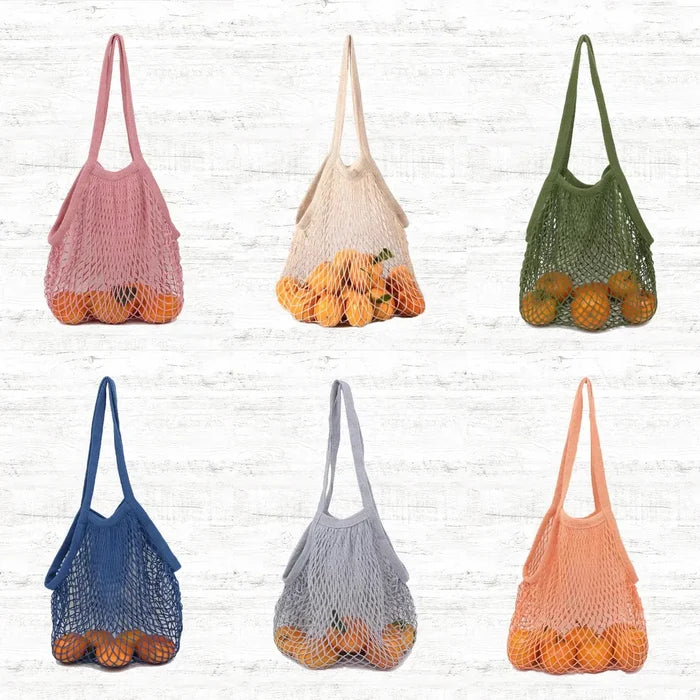 Front view of Six colorful cotton net shopper bags,  oranges,  pink, beige, green, blue, grey.