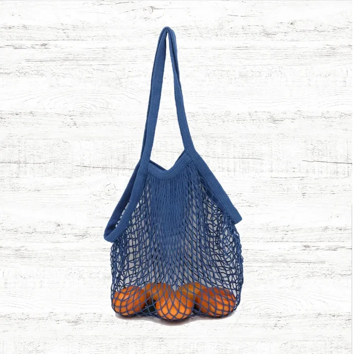 Folded view of Colorful Net Shopper Bag in blue, easy for commuting and weekends.