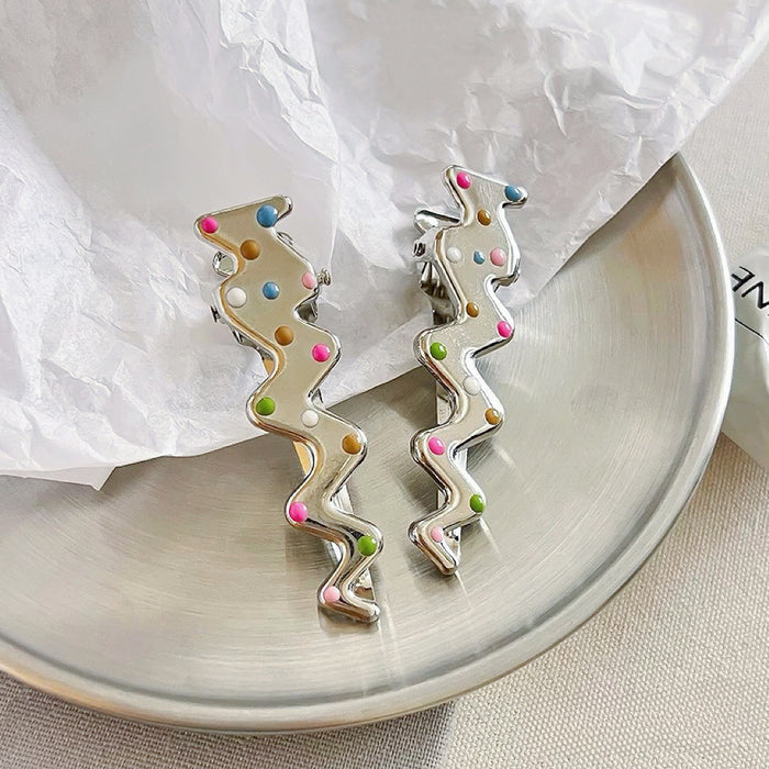 Flat lay of Colorful Polka Dot Hair Clip in lightning shape, great for everyday styling and gifting.