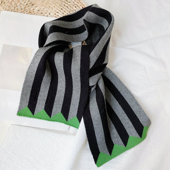 Model wearing a striped polyester scarf in green and gray, great for office layering and commuting.