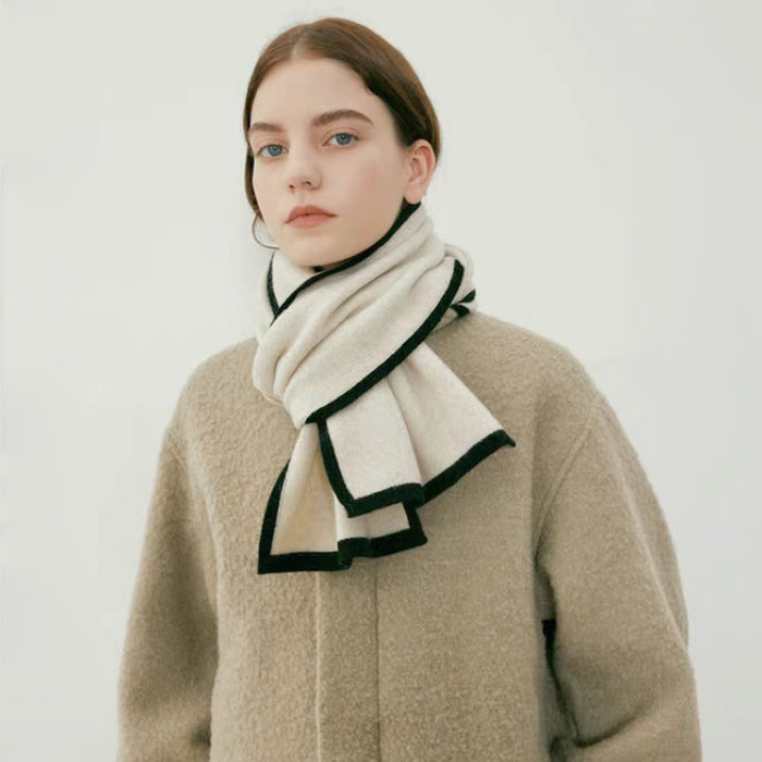 Model wearing a wool knit scarf in beige and white, great for office layering and commuting.