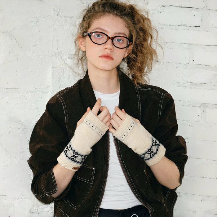 Model wearing cream Fair Isle convertible knit cuffs over dark gloves; cozy winter accessory for outdoors.