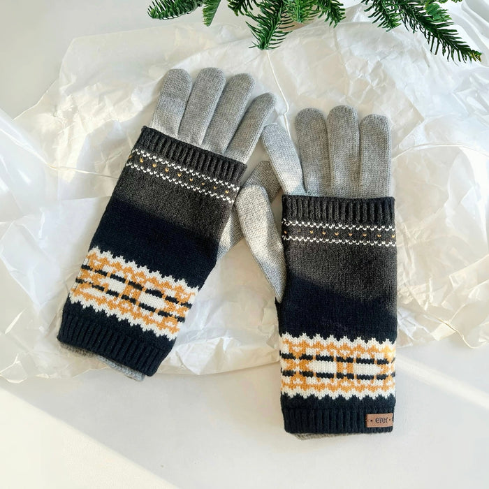 Convertible Fair Isle knit cuff gloves in navy/grey with tan pattern, layered over grey gloves; cozy winter wear.