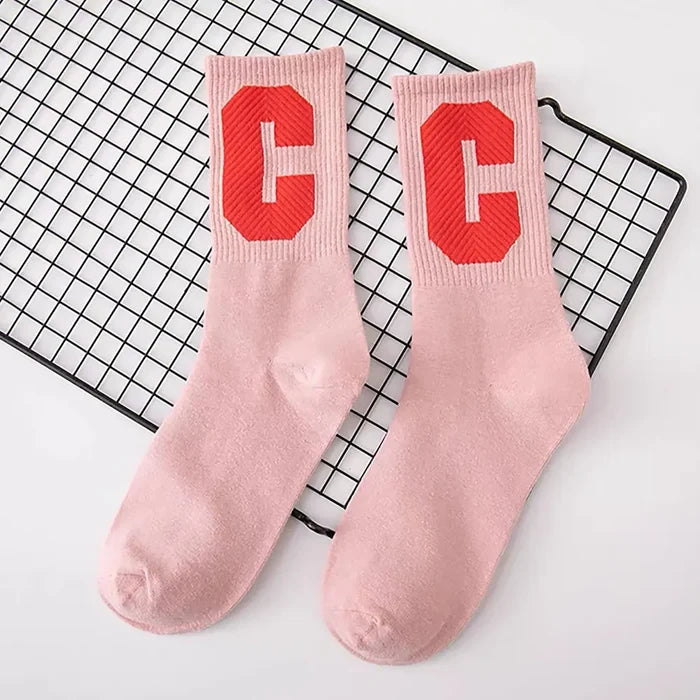 Folded view of Cool C Socks in pink, ideal for workouts and commuting.
