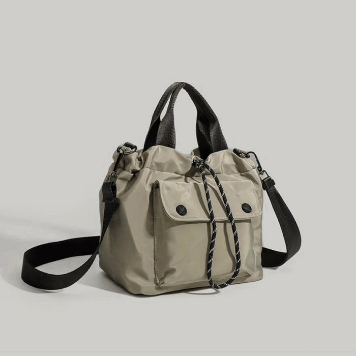 Khaki cube utility bag featuring a compact and durable design.