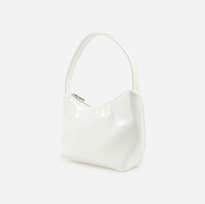 Angled view of Cool Patent Leather Shoulder Bag in white, great for everyday carry and travel.