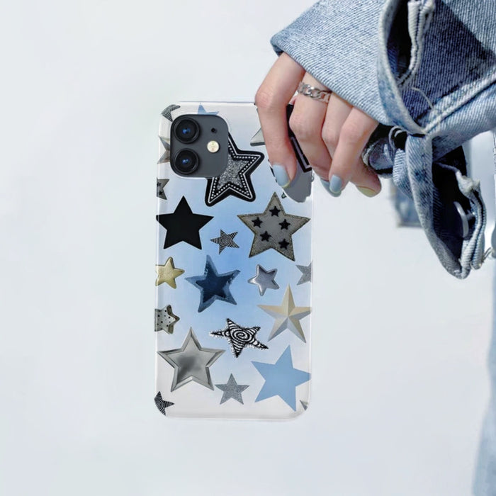 Clear silicone iPhone case with various black, silver, and blue stars. Transparent youthful design accessory.