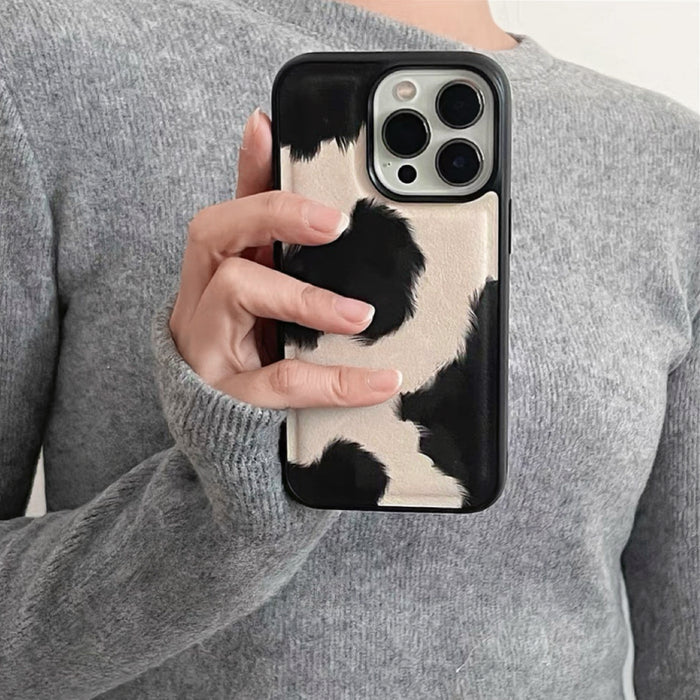 Model holding Cow Print Leather Case. Premium faux-leather finish perfect for streetwear and daily outfits.