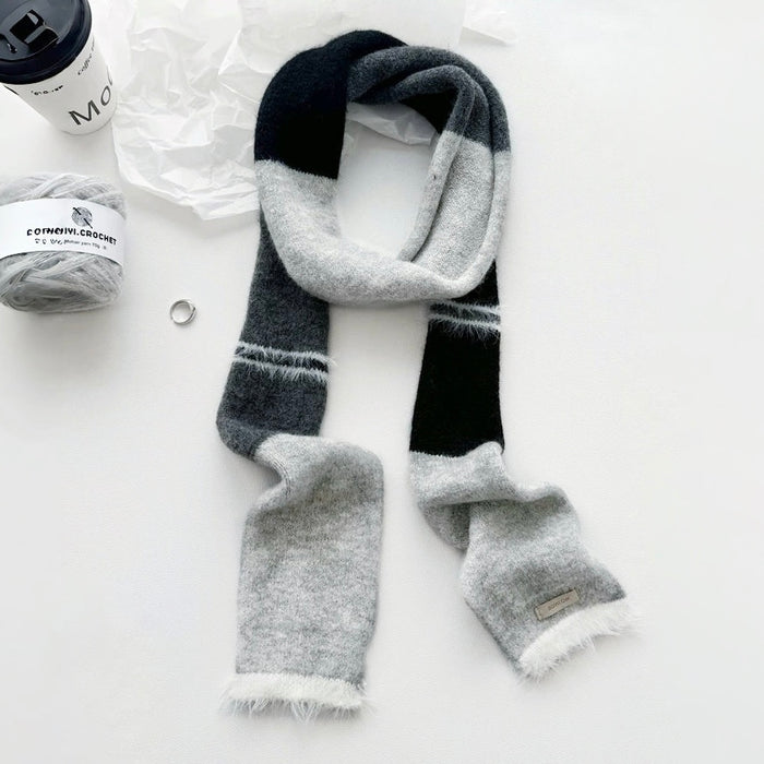 Flat lay of Cozy Patch Skinny Scarf in gray, great for office layering and commuting.