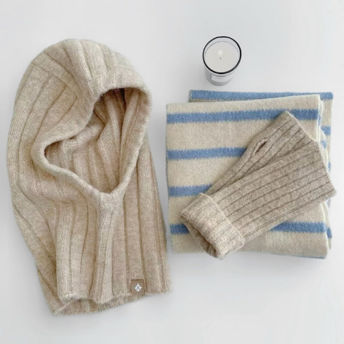 Front view of beige ribbed knit balaclava hat. Elegant neutral tone for sophisticated winter layering.