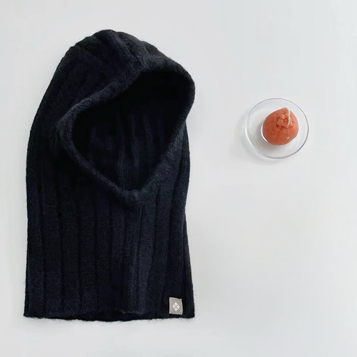 Front view of black ribbed knit balaclava hat. Sleek minimalist aesthetic for versatile cold-weather gear.
