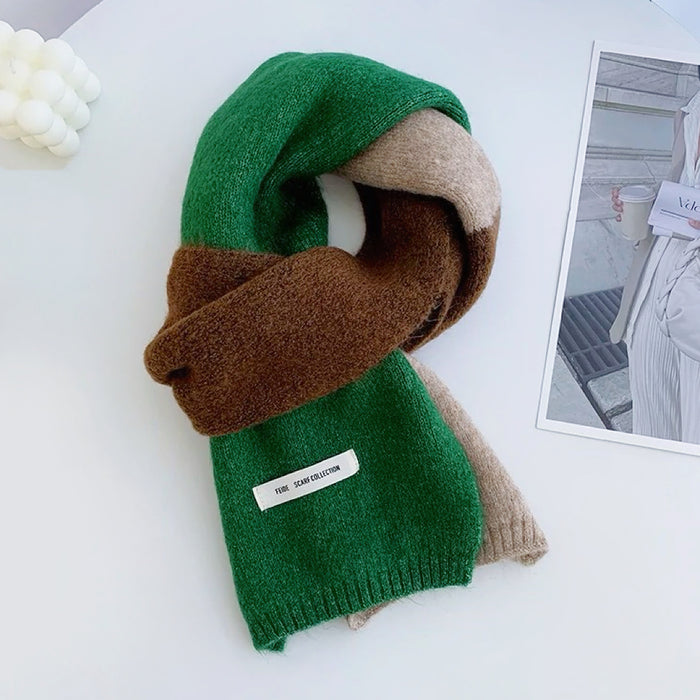 Model wearing a wool scarf in green, ideal for daily wear and travel.