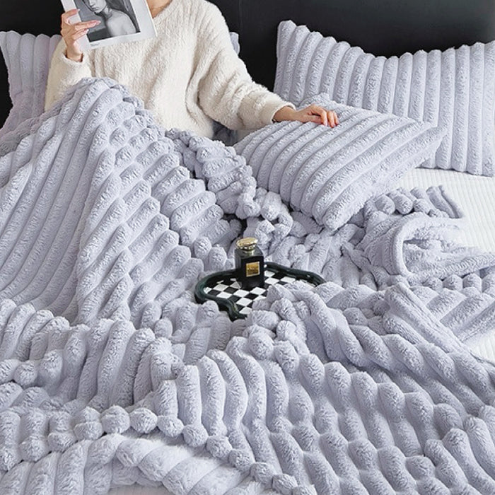 Purple wave textured fleece blanket showing soft polar fabric and unique pattern.