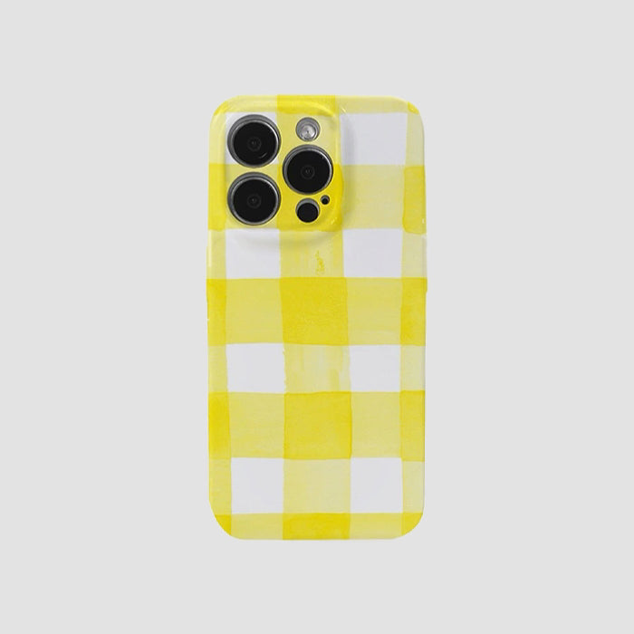 Cream yellow and white checker acrylic phone case. Soft palette aesthetic with precise camera cutouts.