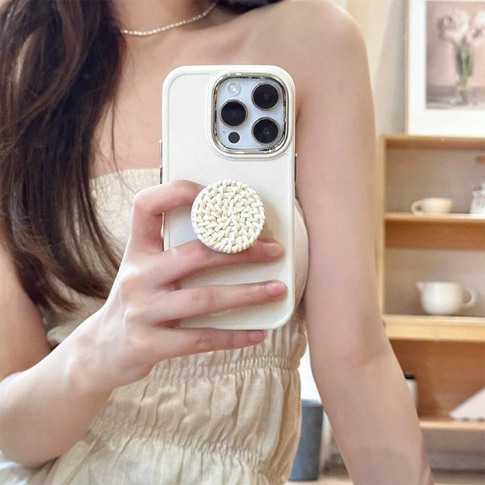 Model holding Creamy Case with Rattan Stand. Innovative integrated kickstand with a matte cream finish.