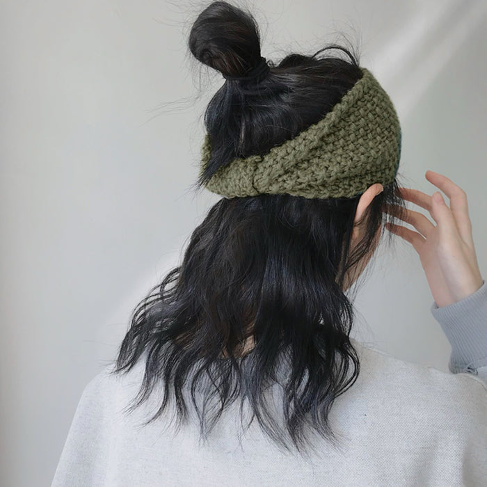 Model wearing a Crochect Bow Headband in green, ideal for quick updos and ponytails.