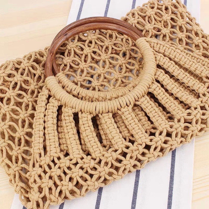 Close-up of camel cotton crochet handbag with round wooden ring handles.