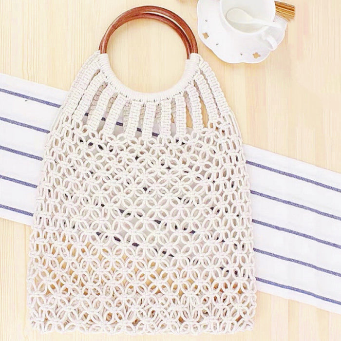 Flat lay of Crochet Handbag With Wooden Ring in white, great for everyday carry and travel.
