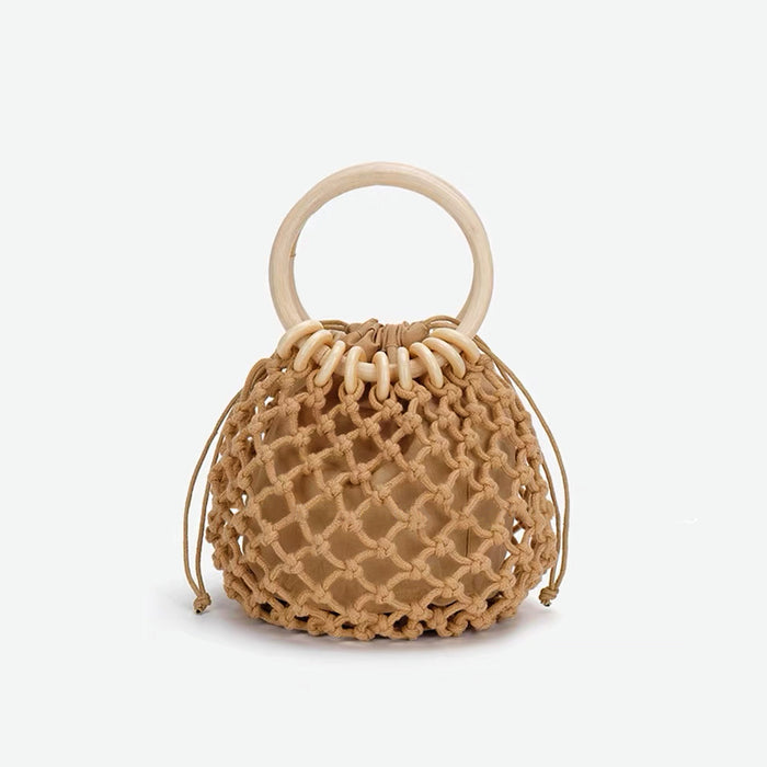 Close-up of brown crochet mini handbag with a light wooden ring .