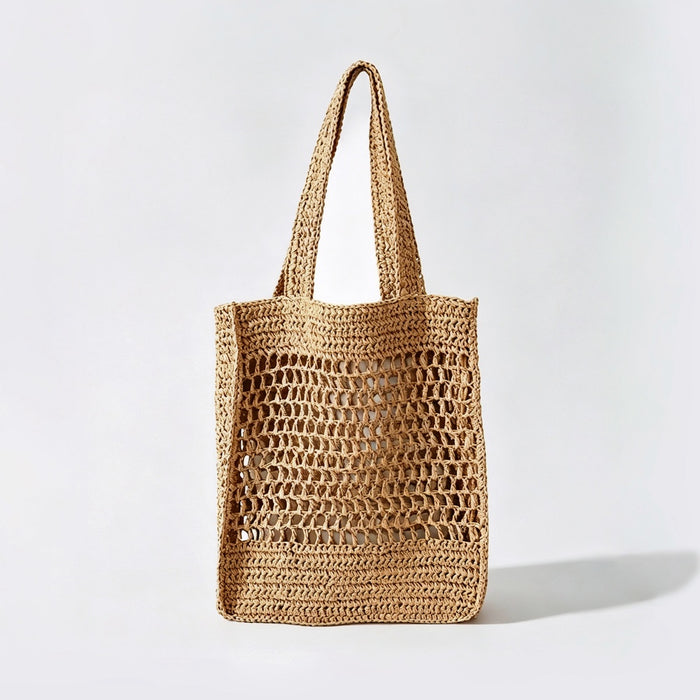 Front view of natural khaki crochet straw tote bag, boho vacation style.