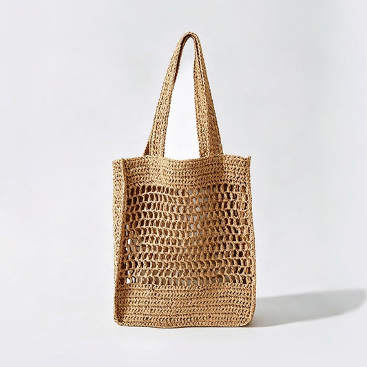 Front view of natural khaki crochet straw tote bag, boho vacation style.
