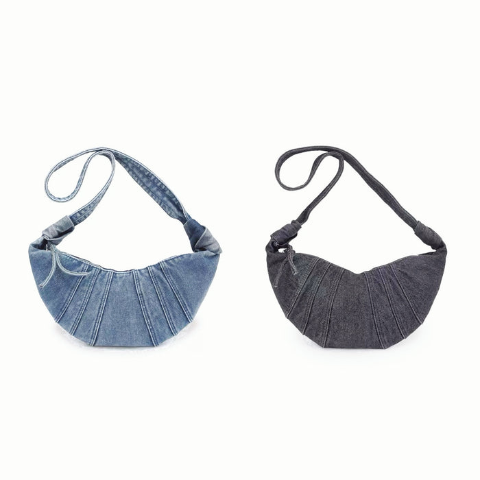 Two colors of Croissant Denim Shoulder Bag shown together, .one is blue and the other is black.