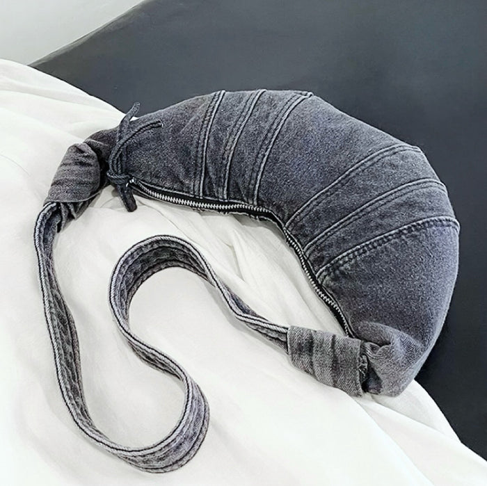 Folded view of Croissant Denim Shoulder Bag in washed black, easy for commuting and weekends.