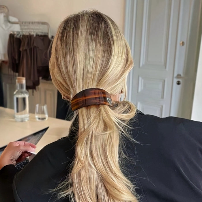 Model wearing a Curved Hair pin With Rhinestones, great for everyday styling and gifting.