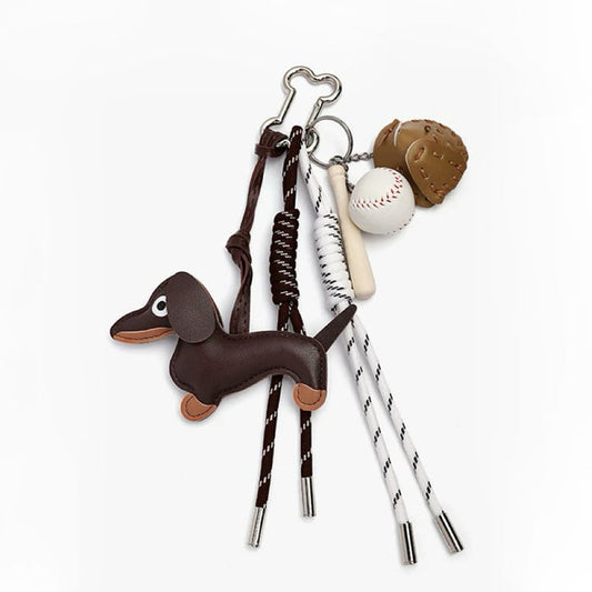 Dachshund bag charm with brown leather dog and baseball elements; trendy sausage dog accessory under $30.