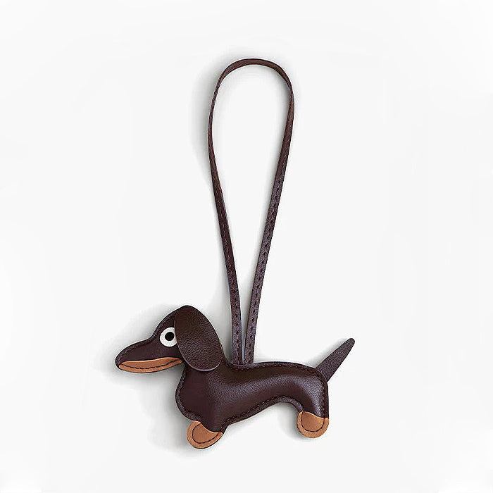 Simple view of the brown leather dachshund charm; chic sausage dog gift for pet lovers and bag lovers.